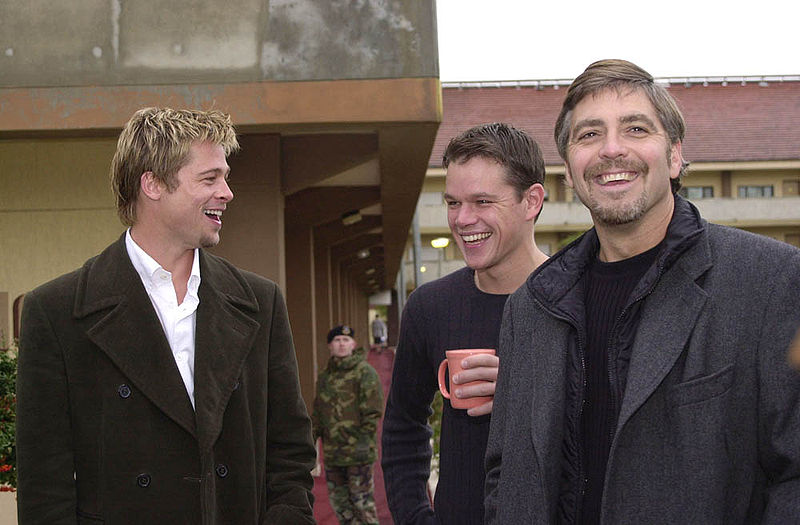 Photo of Brad Pitt, George Clooney, Matt Damon sporting gelled bleached hair.
