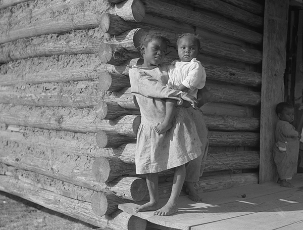 Black and white photograph of the children of former slaves taken in Gees Bend, Alabama. Courtesy of the Library of Congress.