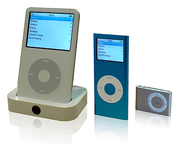 Photograph of three generations of iPods - The iPod, the iPod-Mini, and the iPod Nano.