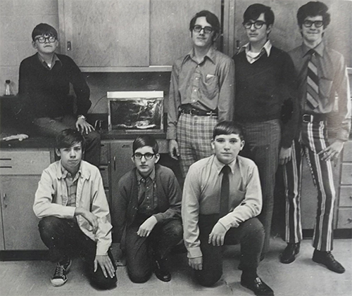 Black and white photograph of students posing in a science classroom.